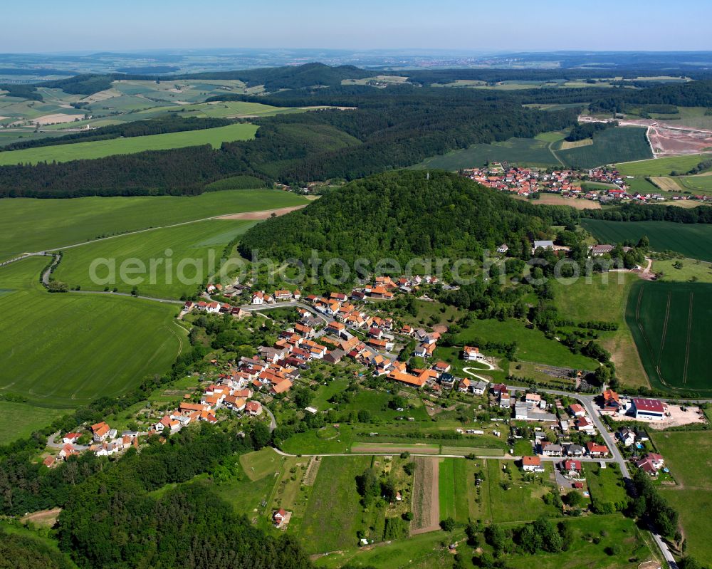 Marth from above - Agricultural land and field boundaries surround the settlement area of the village in Marth in the state Thuringia, Germany