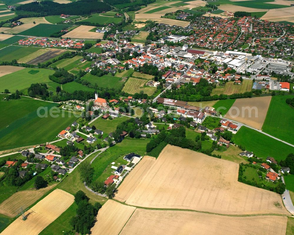 Massing from the bird's eye view: Agricultural land and field boundaries surround the settlement area of the village in Massing in the state Bavaria, Germany