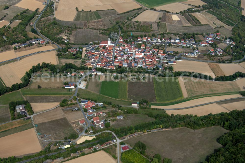 Aerial image Müdesheim - Agricultural land and field boundaries surround the settlement area of the village in Müdesheim in the state Bavaria, Germany