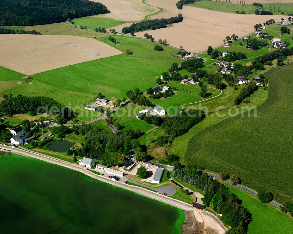 Aerial image Müdisdorf - Agricultural land and field boundaries surround the settlement area of the village in Müdisdorf in the state Saxony, Germany