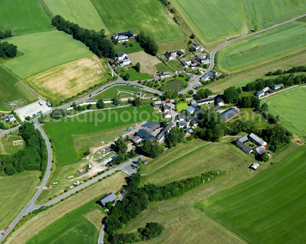 Aerial image Mödlareuth - Agricultural land and field boundaries surround the settlement area of the village in Moedlareuth in the state Bavaria, Germany