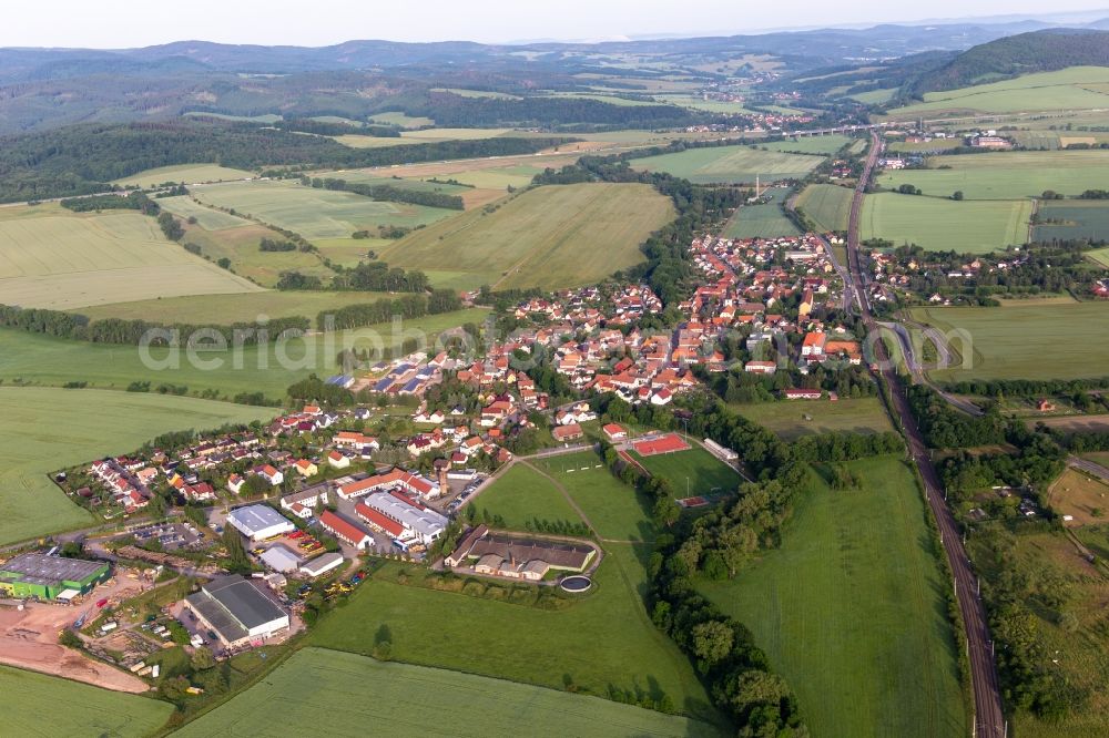 Mechterstädt from above - Agricultural land and field boundaries surround the settlement area of the village in Mechterstaedt in the state Thuringia, Germany