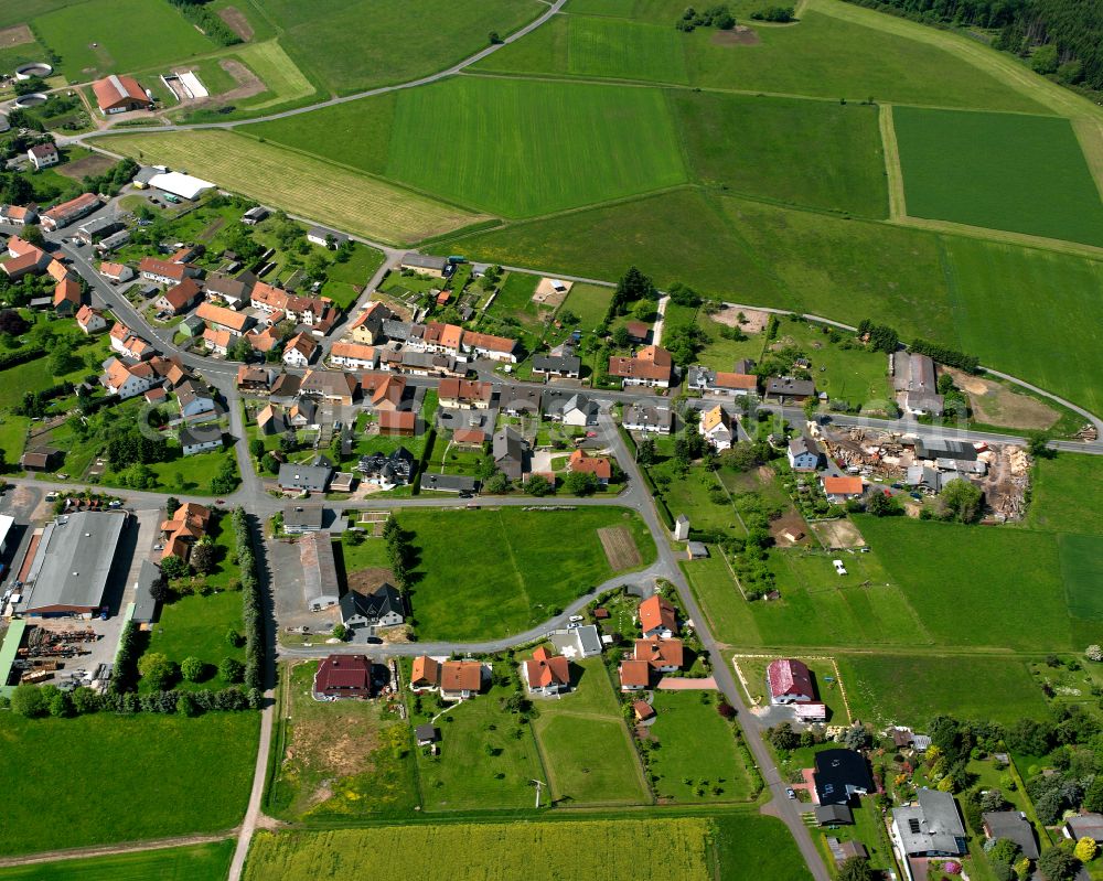 Aerial photograph Meiches - Agricultural land and field boundaries surround the settlement area of the village in Meiches in the state Hesse, Germany