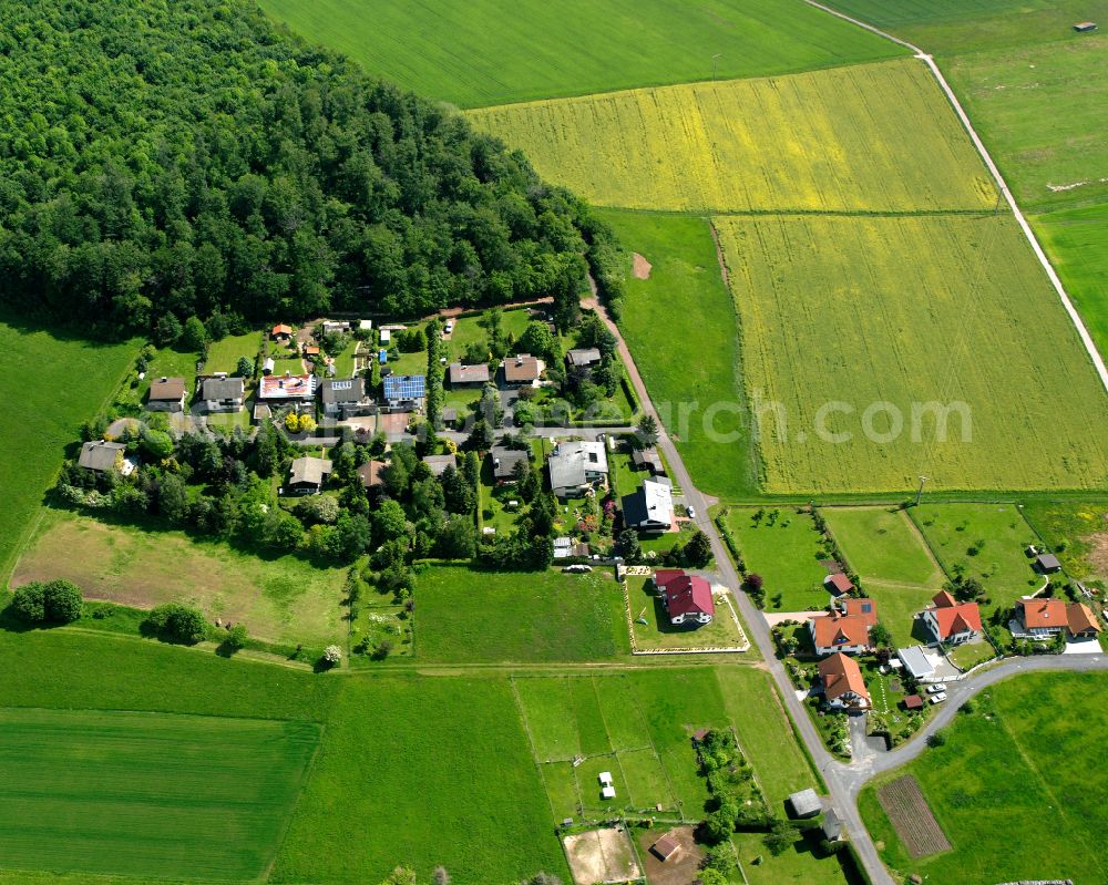 Aerial image Meiches - Agricultural land and field boundaries surround the settlement area of the village in Meiches in the state Hesse, Germany