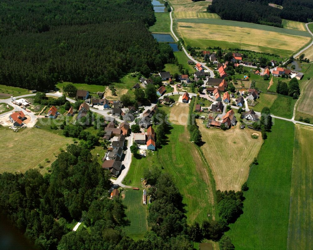 Aerial image Meierndorf - Agricultural land and field boundaries surround the settlement area of the village in Meierndorf in the state Bavaria, Germany