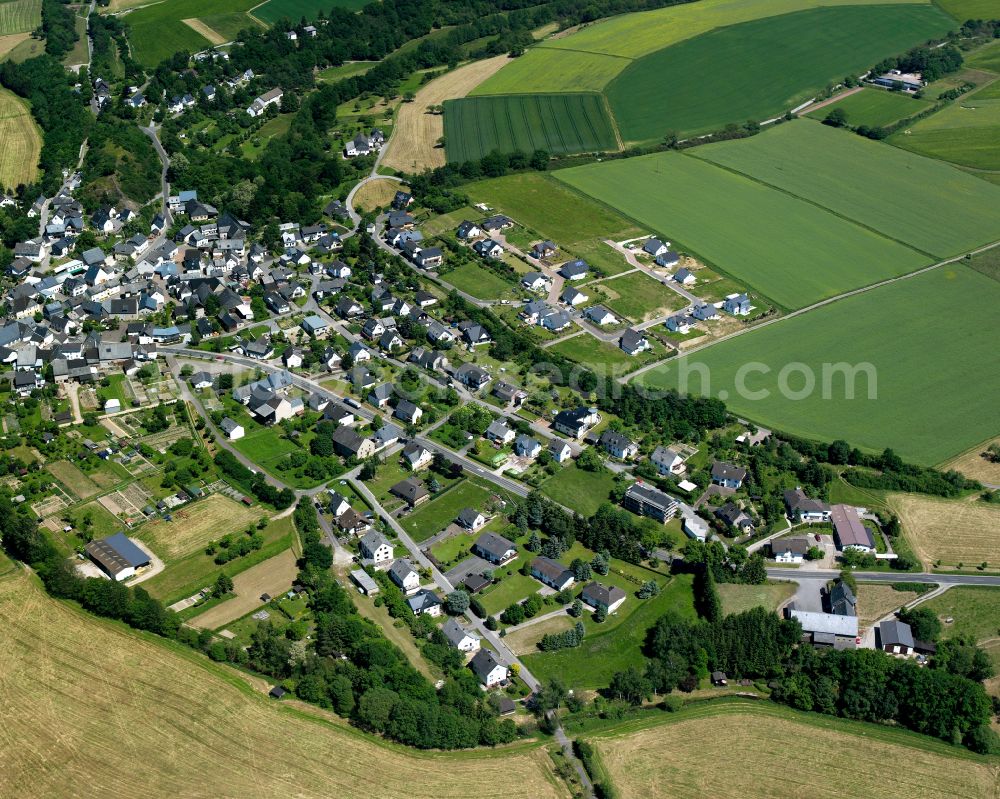 Aerial image Mengerschied - Agricultural land and field boundaries surround the settlement area of the village in Mengerschied in the state Rhineland-Palatinate, Germany