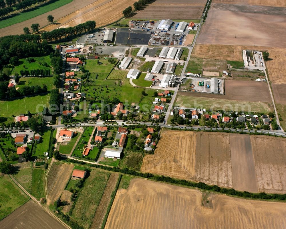 Merxleben from above - Agricultural land and field boundaries surround the settlement area of the village in Merxleben in the state Thuringia, Germany