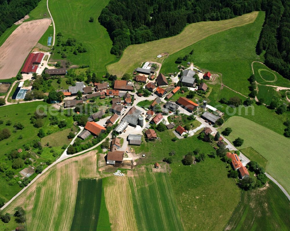 Mettelberg from above - Agricultural land and field boundaries surround the settlement area of the village in Mettelberg in the state Baden-Wuerttemberg, Germany