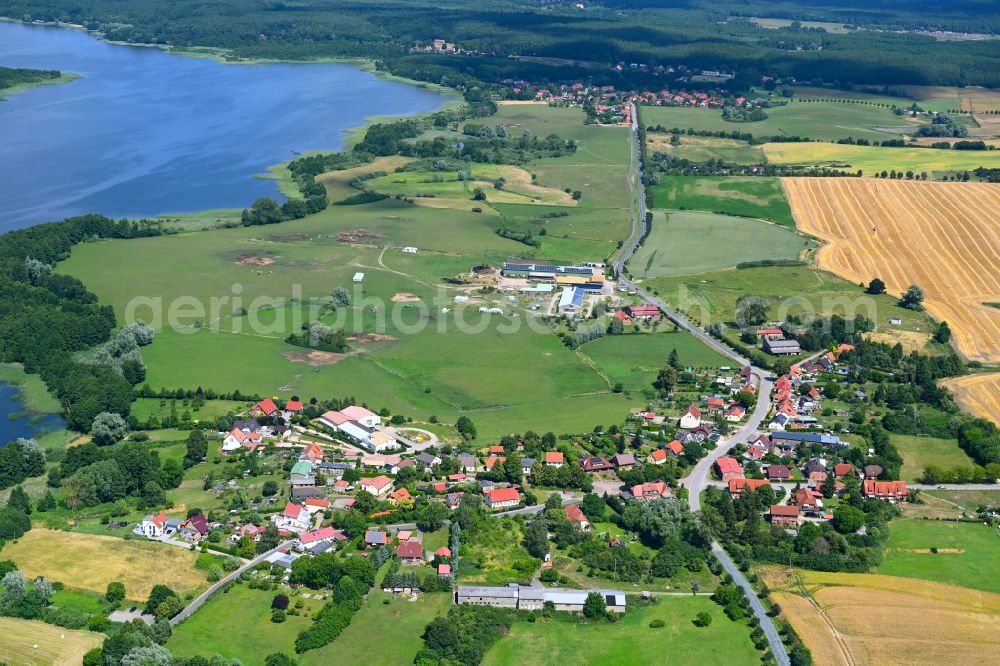 Aerial image Mühl Rosin - Agricultural land and field boundaries surround the settlement area of the village in Mühl Rosin in the state Mecklenburg - Western Pomerania, Germany