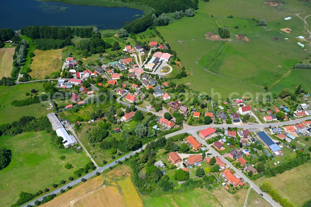 Mühl Rosin from above - Agricultural land and field boundaries surround the settlement area of the village in Mühl Rosin in the state Mecklenburg - Western Pomerania, Germany