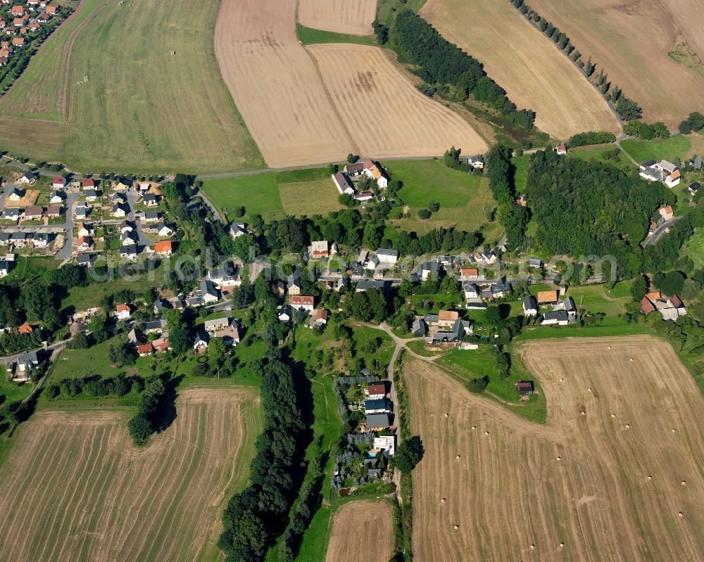 Aerial image Mühlbach - Agricultural land and field boundaries surround the settlement area of the village in Mühlbach in the state Saxony, Germany