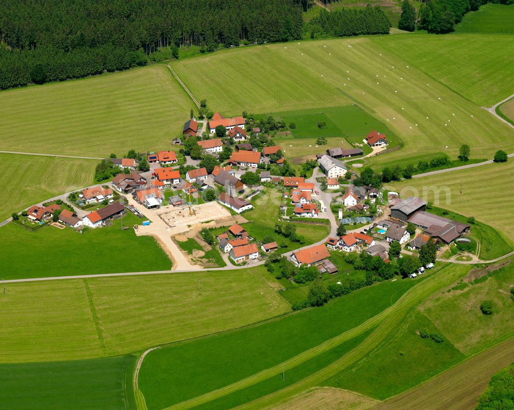 Aerial image Mühlberg - Agricultural land and field boundaries surround the settlement area of the village in Mühlberg in the state Baden-Wuerttemberg, Germany