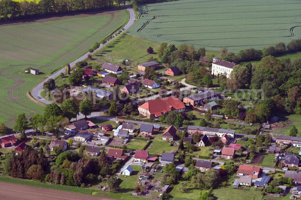 Aerial image Mühlenbeck - Agricultural land and field boundaries surround the settlement area of the village in Mühlenbeck in the state Mecklenburg - Western Pomerania, Germany