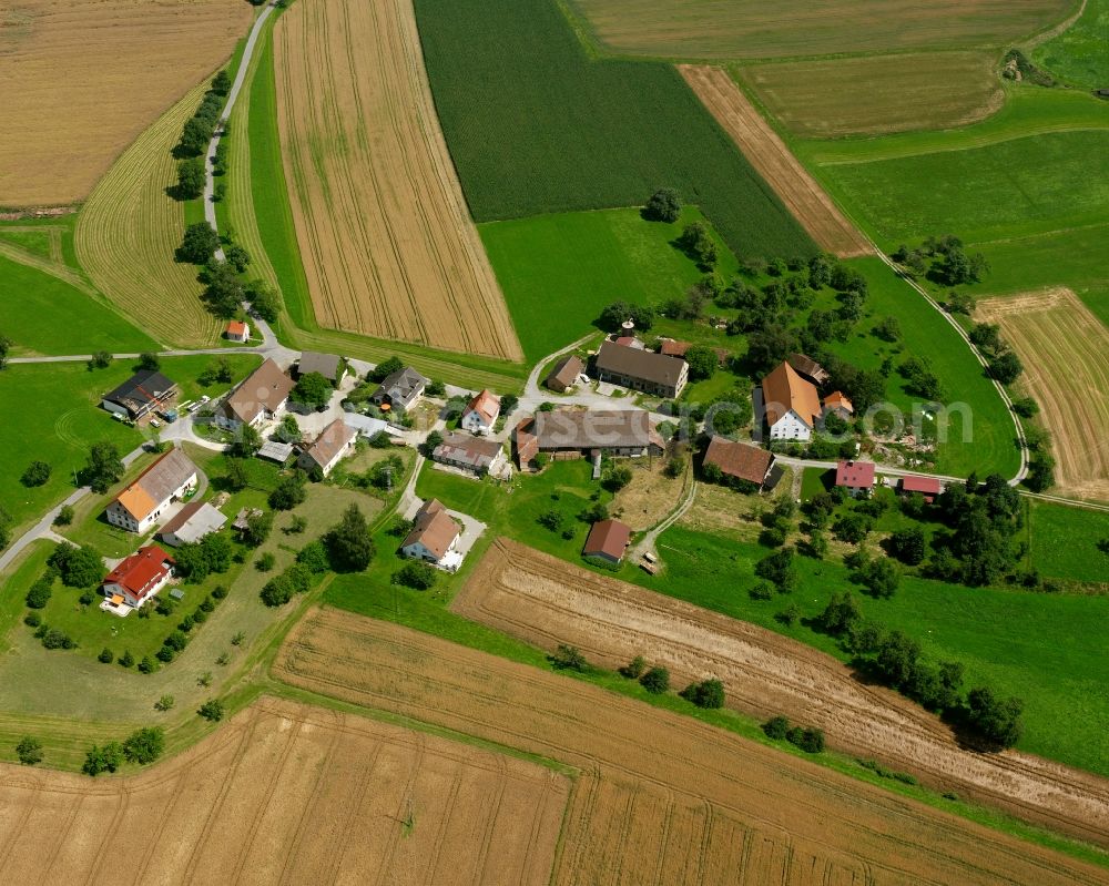 Mühlhausen from above - Agricultural land and field boundaries surround the settlement area of the village in Mühlhausen in the state Baden-Wuerttemberg, Germany