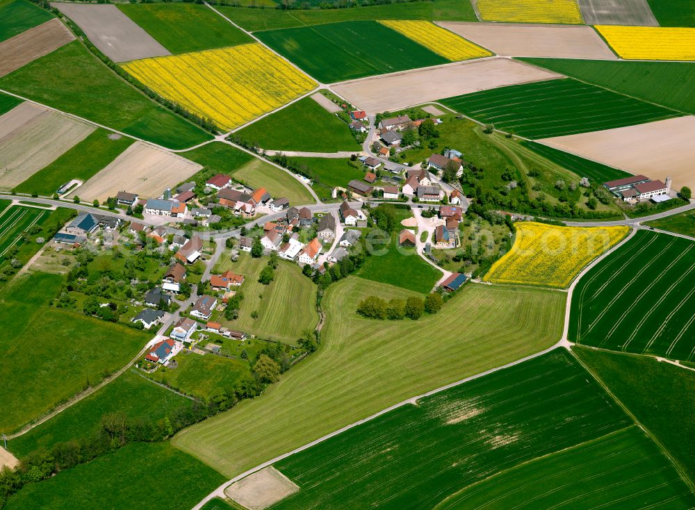 Aerial photograph Mühlhausen - Agricultural land and field boundaries surround the settlement area of the village in Mühlhausen in the state Baden-Wuerttemberg, Germany