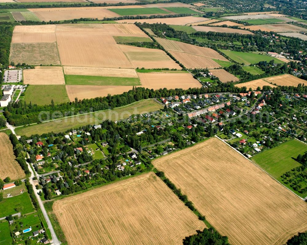 Mühlhausen/Thüringen from above - Agricultural land and field boundaries surround the settlement area of the village in Mühlhausen in the state Thuringia, Germany