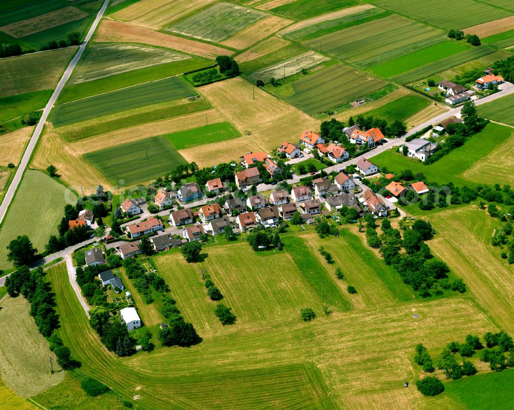 Mähringen from the bird's eye view: Agricultural land and field boundaries surround the settlement area of the village in Mähringen in the state Baden-Wuerttemberg, Germany