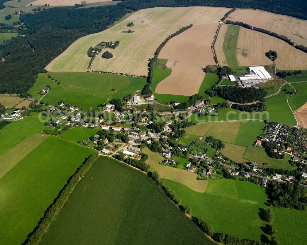 St. Michaelis from the bird's eye view: Agricultural land and field boundaries surround the settlement area of the village in St. Michaelis in the state Saxony, Germany