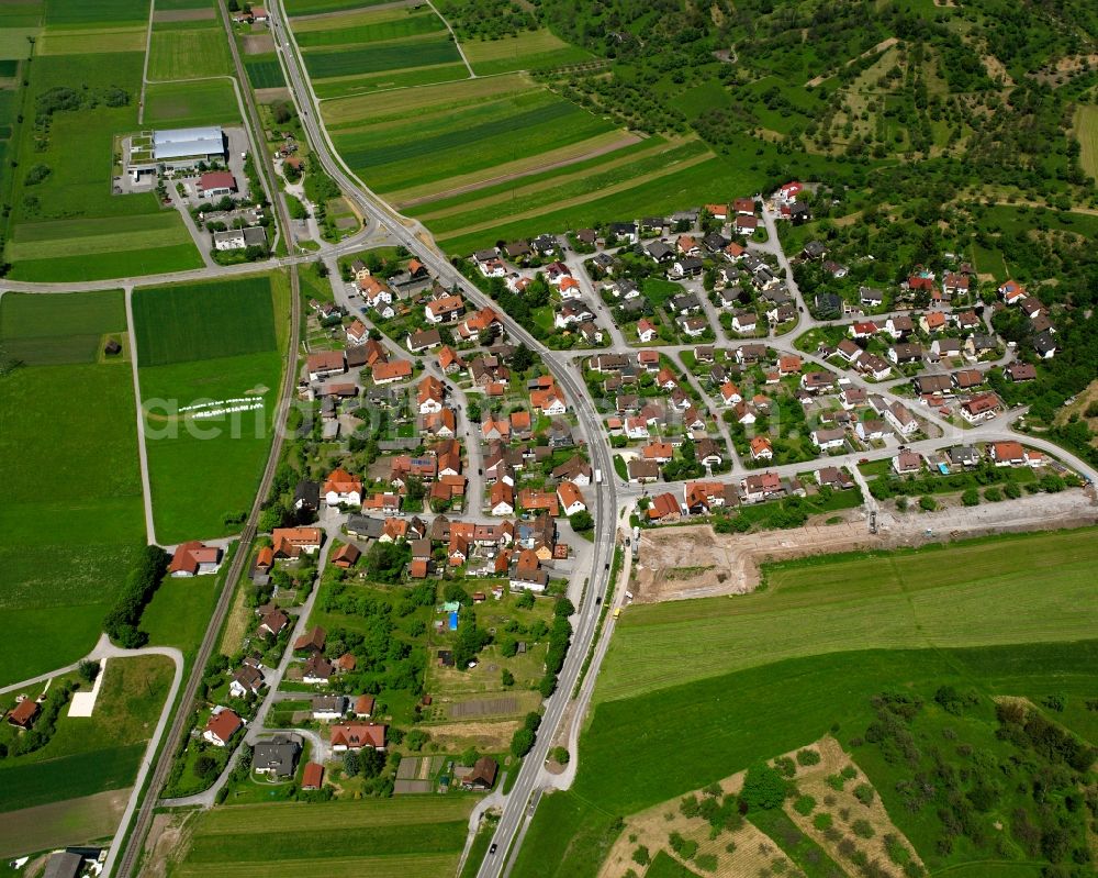 Michelau from the bird's eye view: Agricultural land and field boundaries surround the settlement area of the village in Michelau in the state Baden-Wuerttemberg, Germany