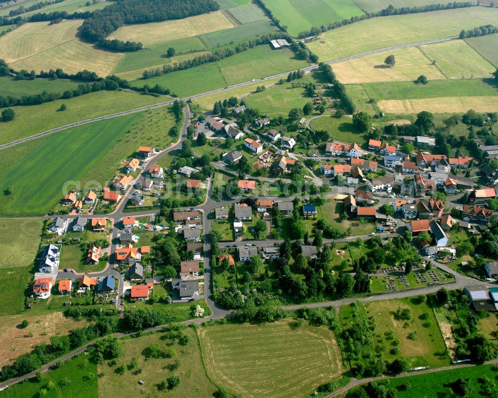 Aerial image Michelbach - Agricultural land and field boundaries surround the settlement area of the village in Michelbach in the state Hesse, Germany