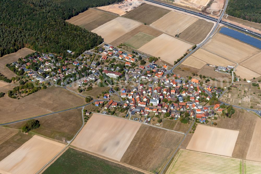 Aerial photograph Michelrieth - Agricultural land and field boundaries surround the settlement area of the village in Michelrieth in the state Bavaria, Germany