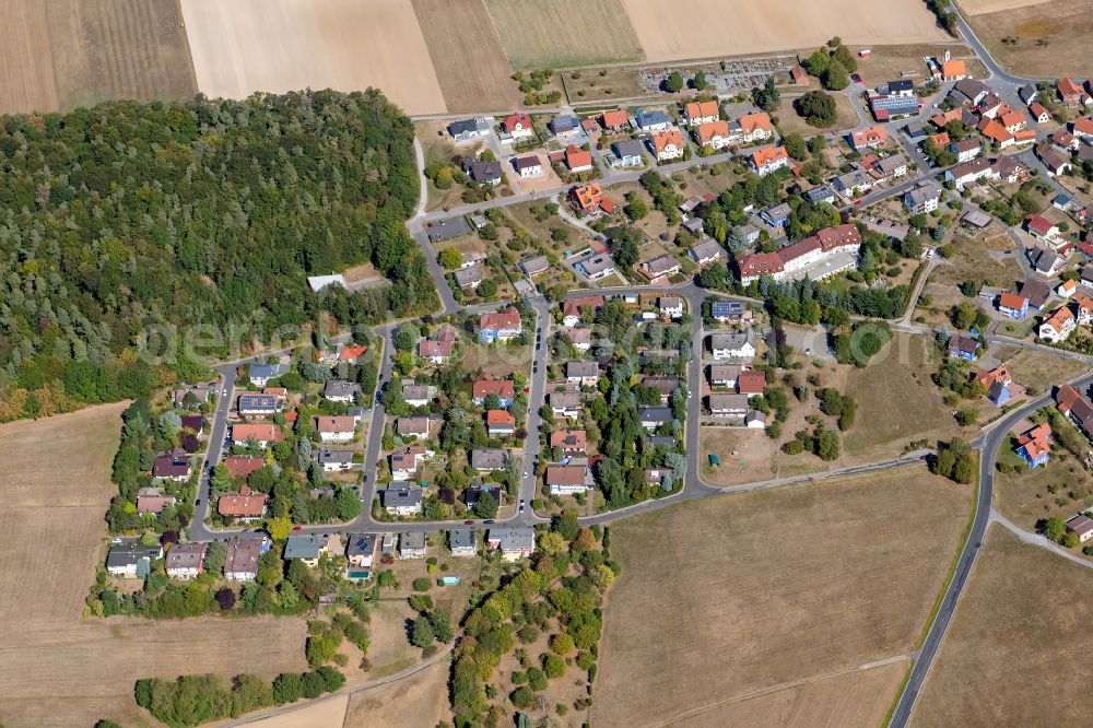 Aerial image Michelrieth - Agricultural land and field boundaries surround the settlement area of the village in Michelrieth in the state Bavaria, Germany