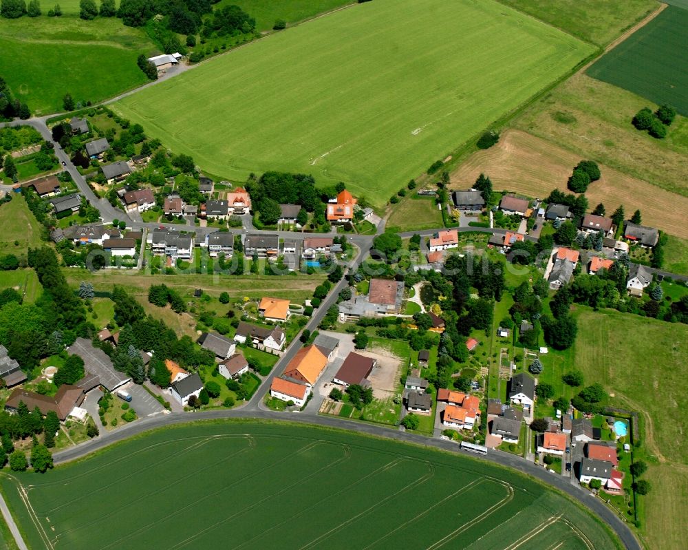 Mielenhausen from above - Agricultural land and field boundaries surround the settlement area of the village in Mielenhausen in the state Lower Saxony, Germany