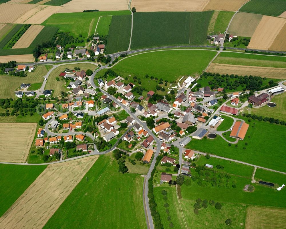 Mieterkingen from above - Agricultural land and field boundaries surround the settlement area of the village in Mieterkingen in the state Baden-Wuerttemberg, Germany