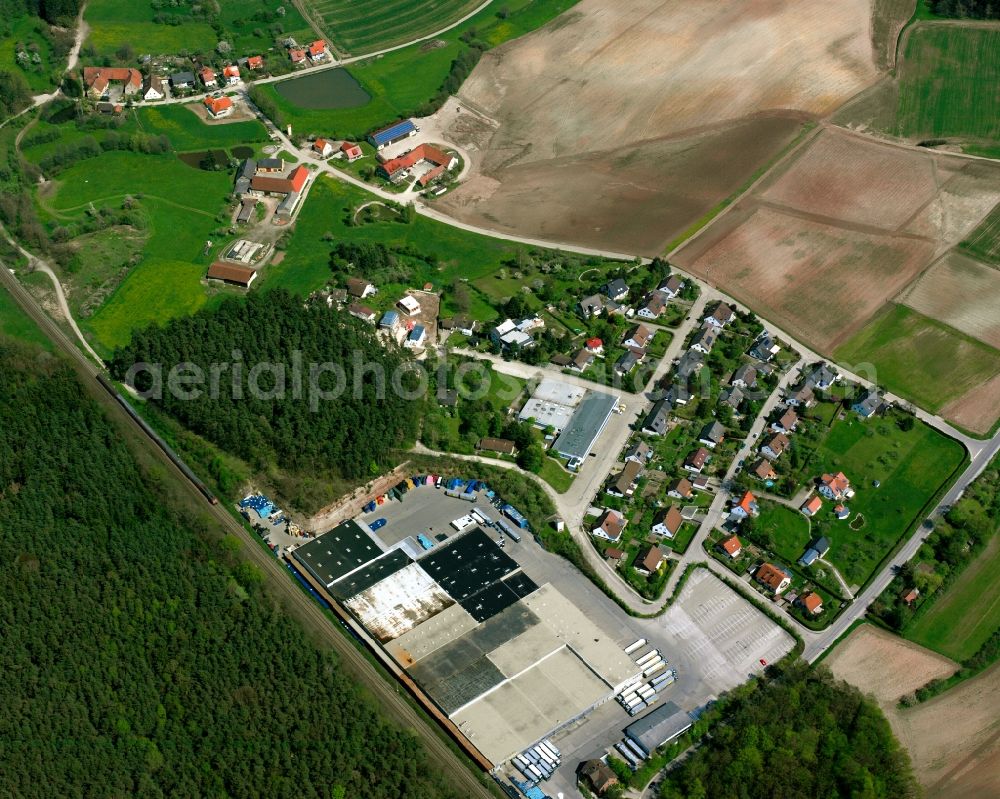 Milmersdorf from above - Agricultural land and field boundaries surround the settlement area of the village in Milmersdorf in the state Bavaria, Germany