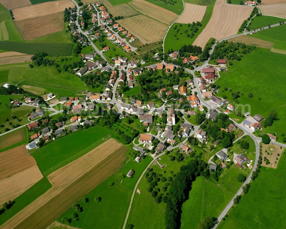 Aerial photograph Mindersdorf - Agricultural land and field boundaries surround the settlement area of the village in Mindersdorf in the state Baden-Wuerttemberg, Germany