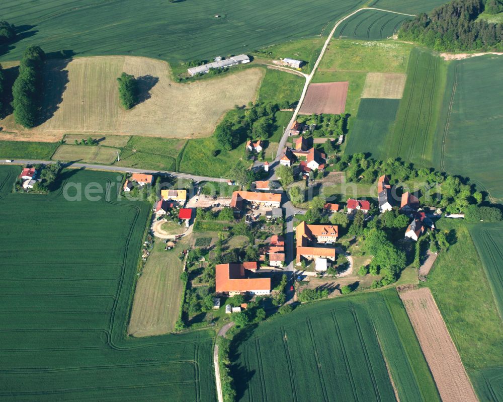 Misserode from above - Agricultural land and field boundaries surround the settlement area of the village in Misserode in the state Thuringia, Germany