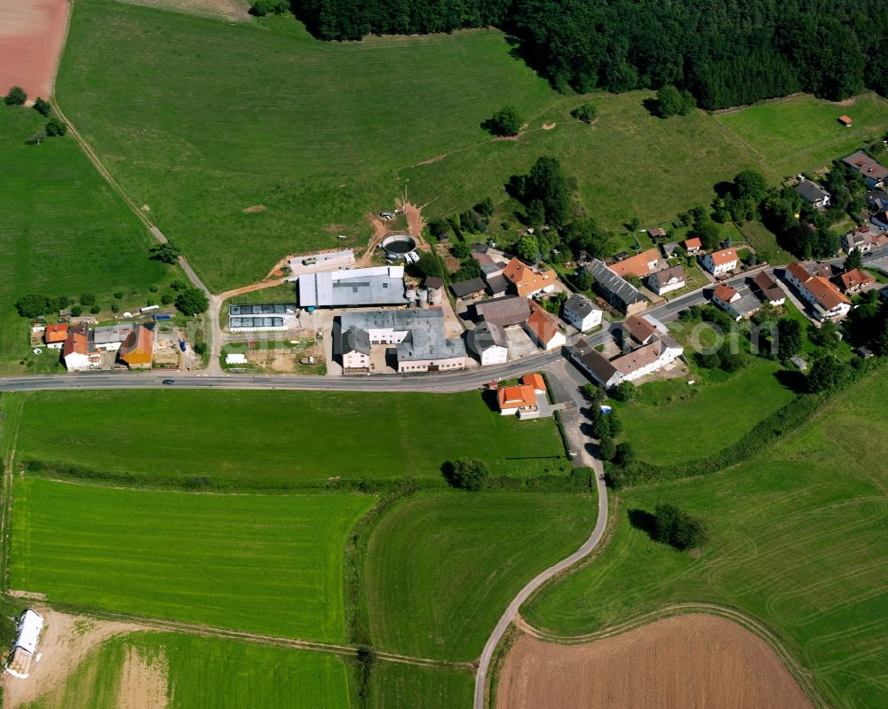 Aerial image Mittel-Kinzig - Agricultural land and field boundaries surround the settlement area of the village in Mittel-Kinzig in the state Hesse, Germany