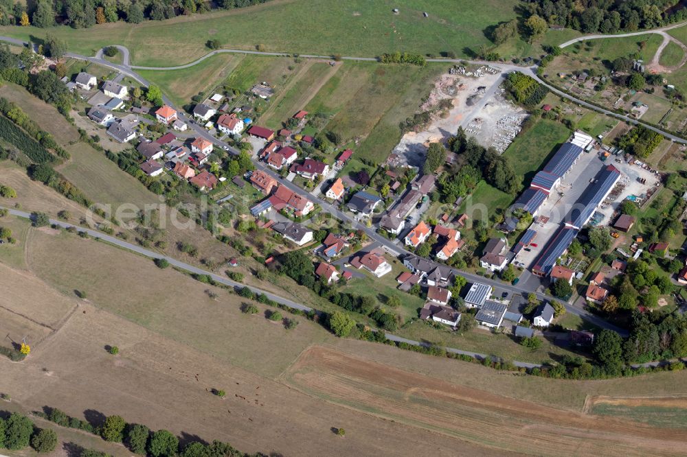 Mittelsinn from the bird's eye view: Agricultural land and field boundaries surround the settlement area of the village in Mittelsinn in the state Bavaria, Germany