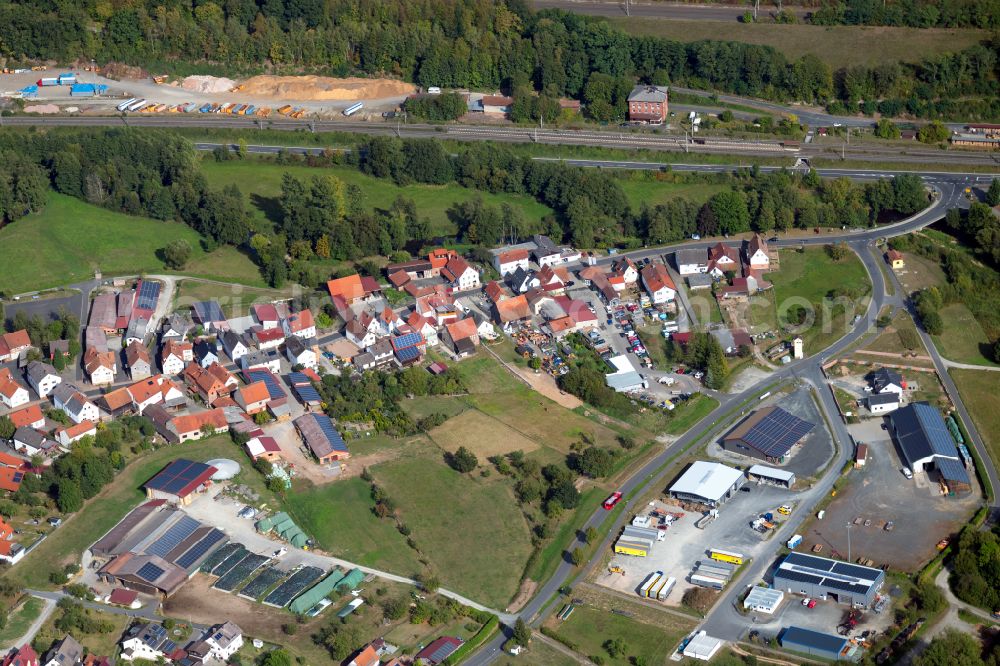 Aerial image Mittelsinn - Agricultural land and field boundaries surround the settlement area of the village in Mittelsinn in the state Bavaria, Germany