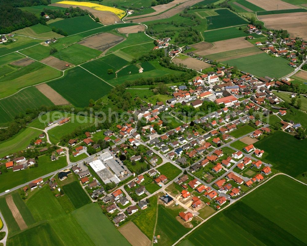 Münchsdorf from the bird's eye view: Agricultural land and field boundaries surround the settlement area of the village in Münchsdorf in the state Bavaria, Germany