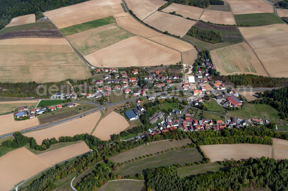 Aerial image Münster - Agricultural land and field boundaries surround the settlement area of the village in Münster in the state Bavaria, Germany