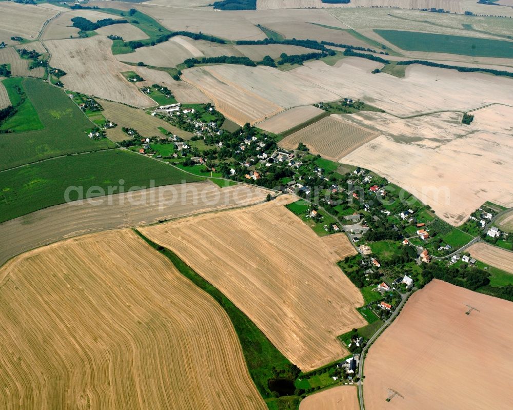 Mobendorf from the bird's eye view: Agricultural land and field boundaries surround the settlement area of the village in Mobendorf in the state Saxony, Germany