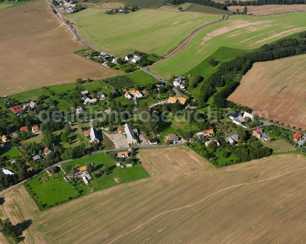 Mobendorf from the bird's eye view: Agricultural land and field boundaries surround the settlement area of the village in Mobendorf in the state Saxony, Germany