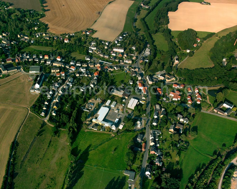 Mohlsdorf from above - Agricultural land and field boundaries surround the settlement area of the village in Mohlsdorf in the state Thuringia, Germany