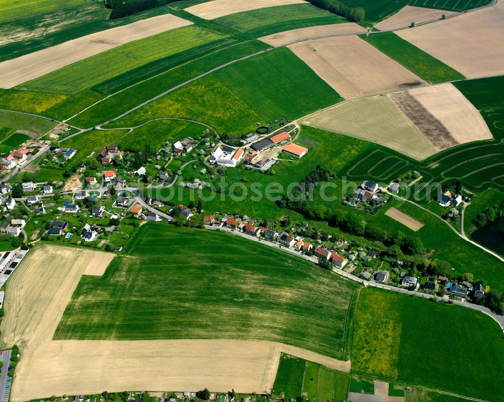 Mohsdorf from above - Agricultural land and field boundaries surround the settlement area of the village in Mohsdorf in the state Saxony, Germany