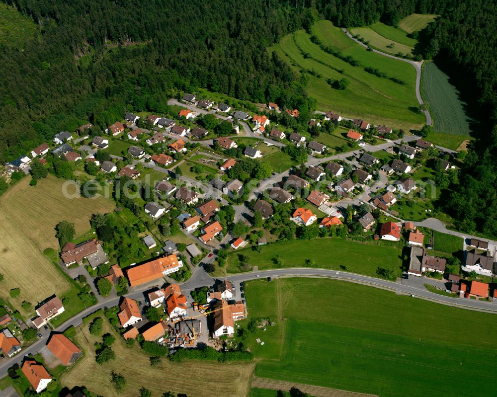 Monakam from above - Agricultural land and field boundaries surround the settlement area of the village in Monakam in the state Baden-Wuerttemberg, Germany