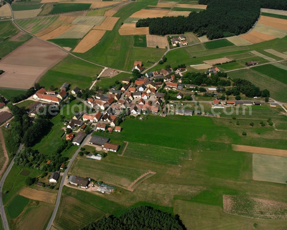 Aerial photograph Moosbach - Agricultural land and field boundaries surround the settlement area of the village in Moosbach in the state Bavaria, Germany