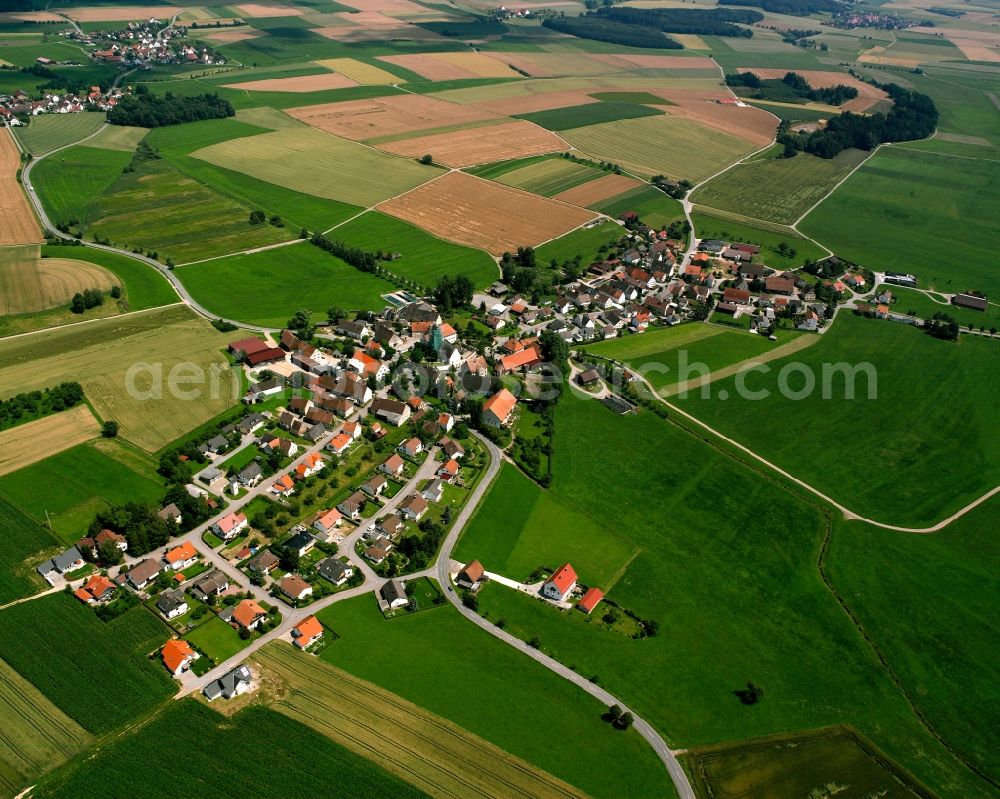 Moosheim from above - Agricultural land and field boundaries surround the settlement area of the village in Moosheim in the state Baden-Wuerttemberg, Germany