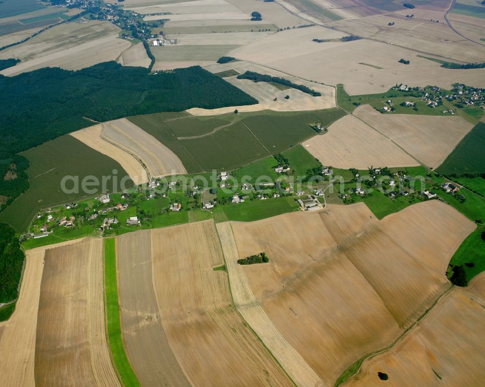 Moosheim from the bird's eye view: Agricultural land and field boundaries surround the settlement area of the village in Moosheim in the state Saxony, Germany