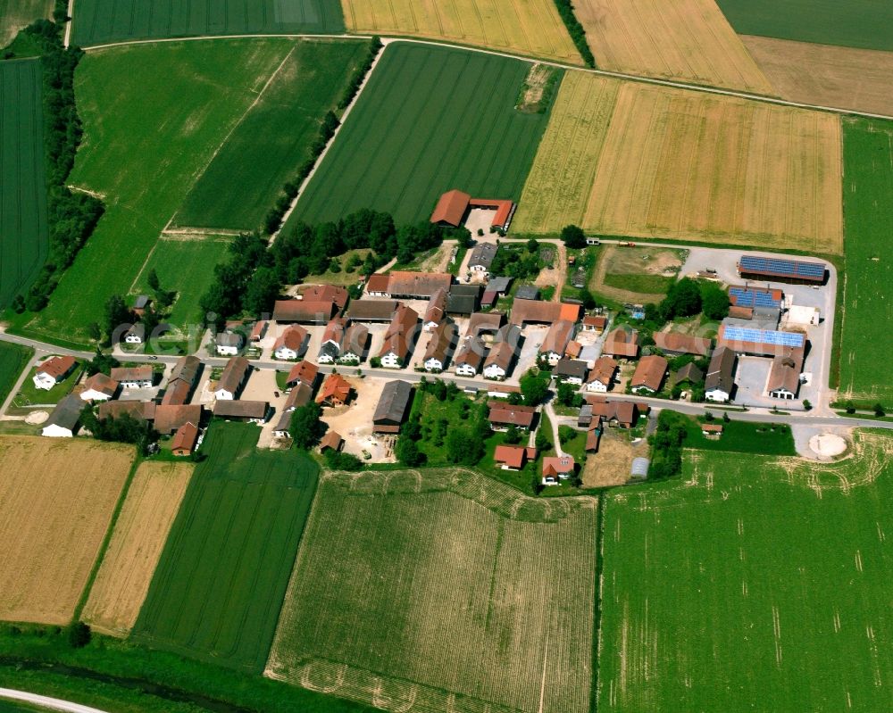 Aerial image Muckenwinkling - Agricultural land and field boundaries surround the settlement area of the village in Muckenwinkling in the state Bavaria, Germany