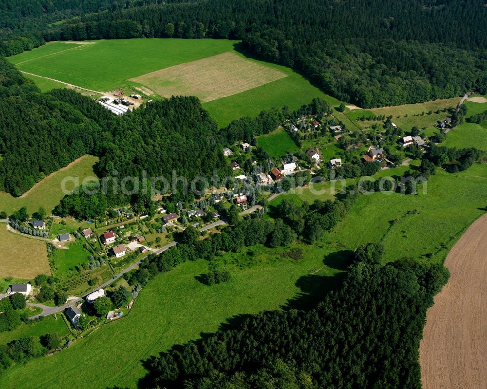 Mulda/Sachsen from the bird's eye view: Agricultural land and field boundaries surround the settlement area of the village in Mulda/Sachsen in the state Saxony, Germany