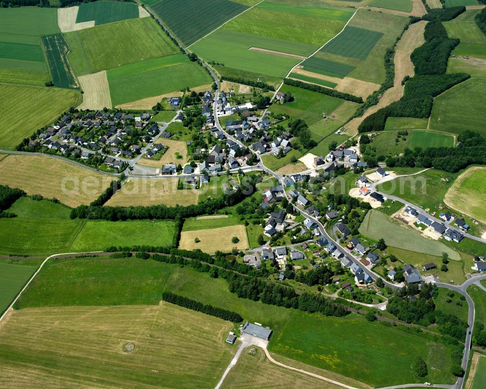 Aerial photograph Nannhausen - Agricultural land and field boundaries surround the settlement area of the village in Nannhausen in the state Rhineland-Palatinate, Germany