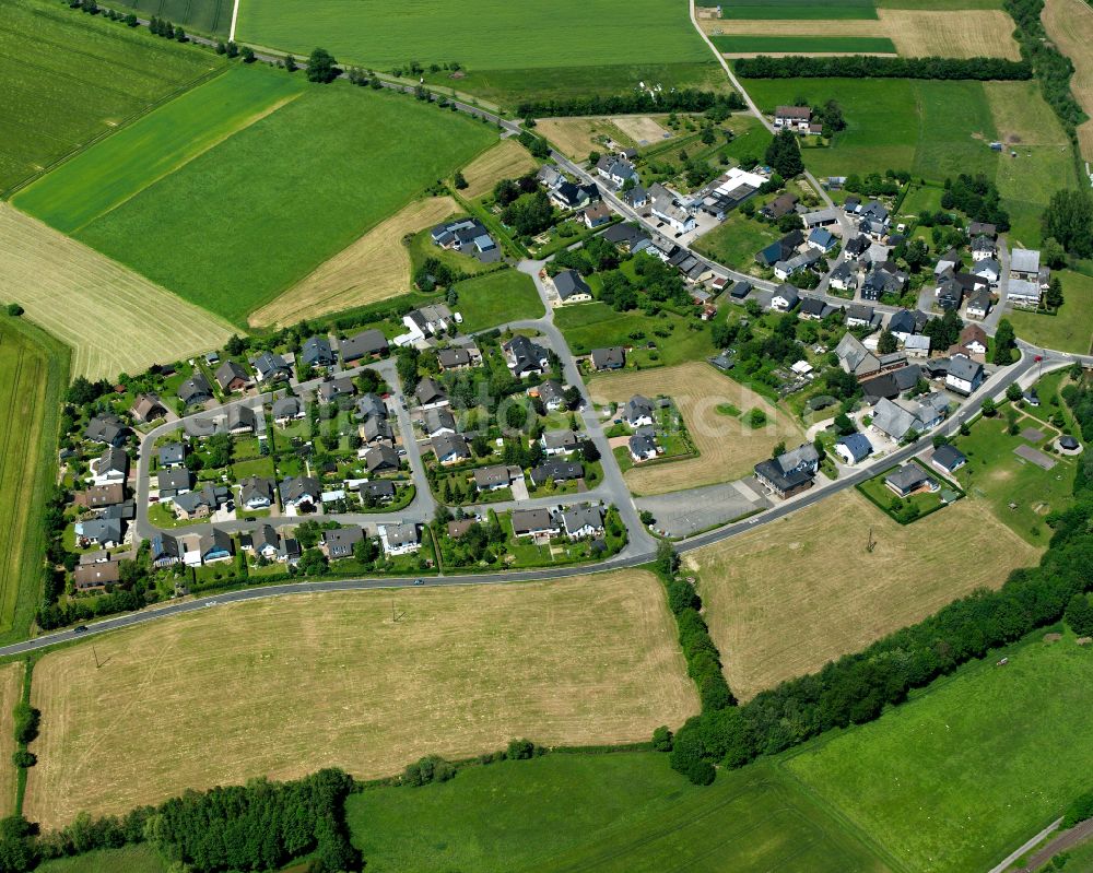 Nannhausen from the bird's eye view: Agricultural land and field boundaries surround the settlement area of the village in Nannhausen in the state Rhineland-Palatinate, Germany