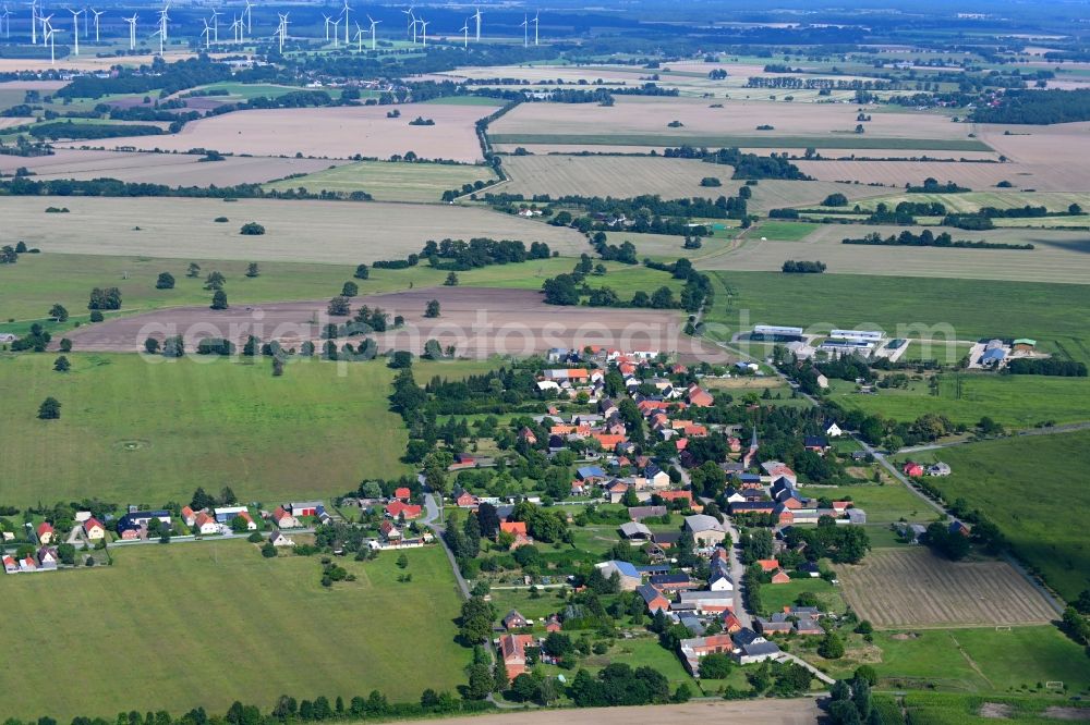 Nebelin from above - Agricultural land and field boundaries surround the settlement area of the village in Nebelin in the state Brandenburg, Germany