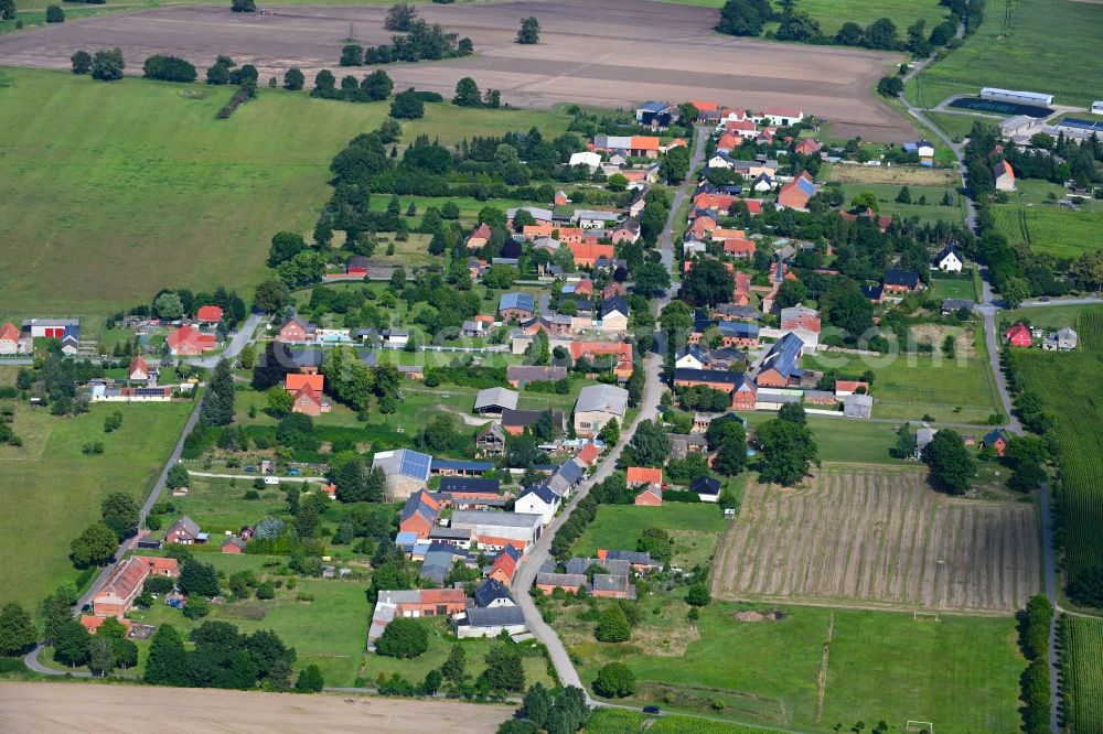 Aerial photograph Nebelin - Agricultural land and field boundaries surround the settlement area of the village in Nebelin in the state Brandenburg, Germany